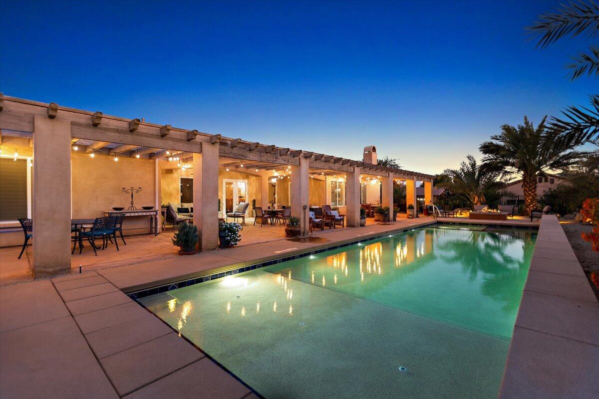 31453 Chimayo Road Thousand Palms, CA 92276 - Photo 65 of 71 a swimming pool with outdoor seating and yard