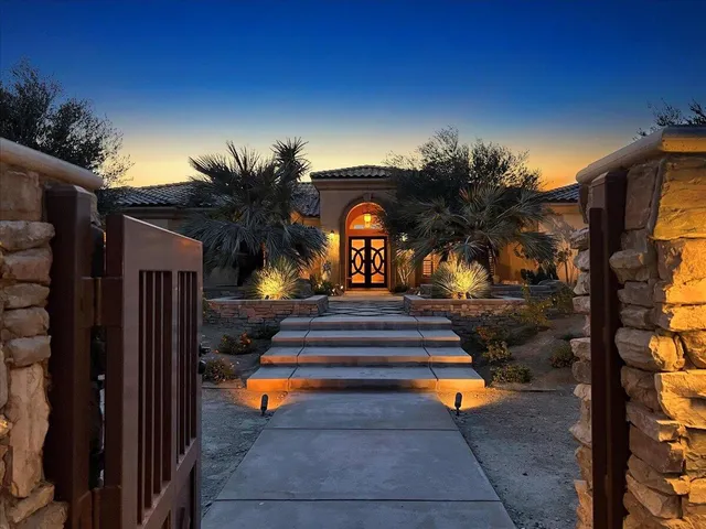 a living room with furniture a large window and a fireplace