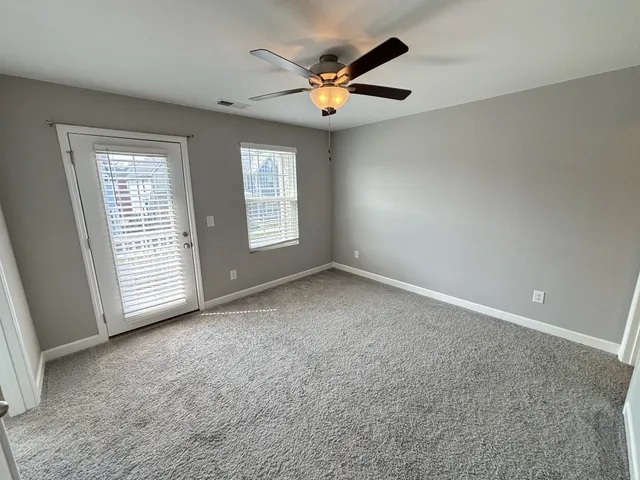 a bathroom with a double vanity sink toilet and shower