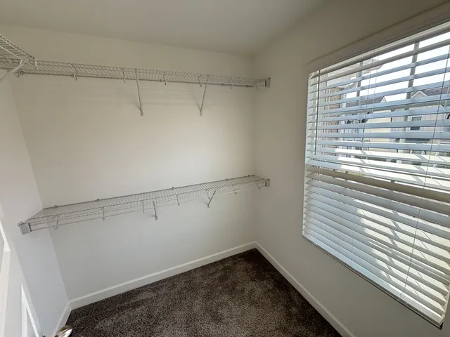 a bathroom with a double vanity sink mirror and toilet