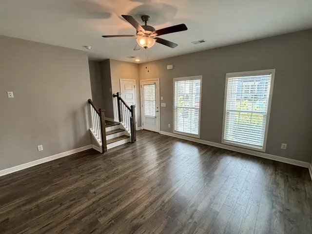 a large kitchen with a refrigerator a sink dishwasher a stove top oven a refrigerator and cabinets