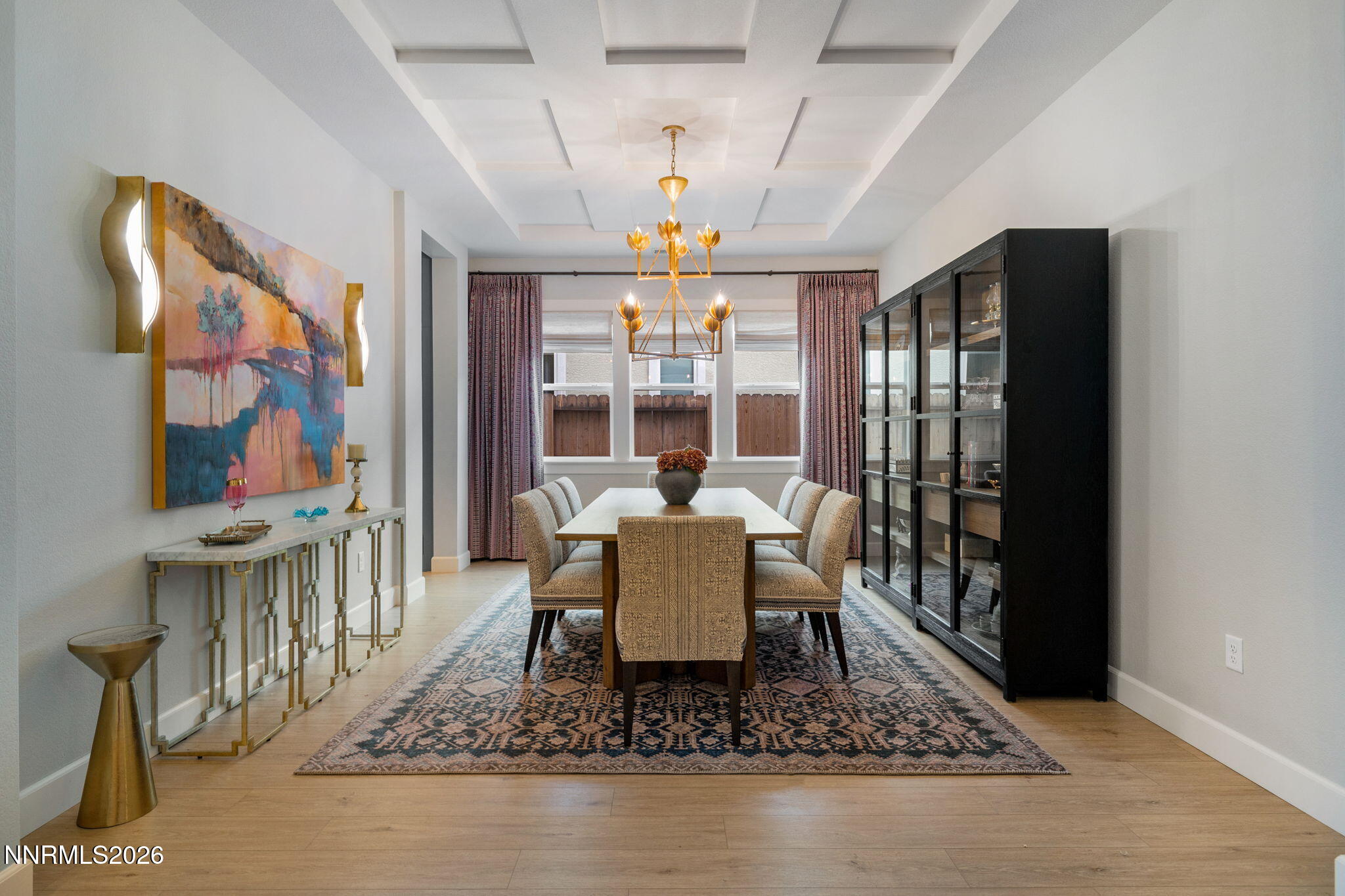 9505 Copper Sky Drive Reno, NV 89521 - Photo 11 of 50 a dining room with furniture a rug and a chandelier