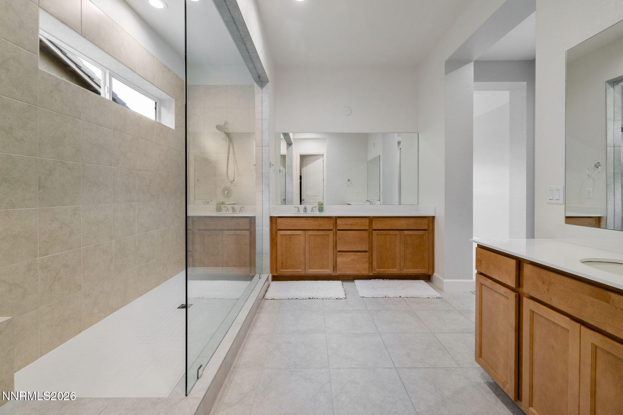 9505 Copper Sky Drive Reno, NV 89521 - Photo 22 of 50 a bathroom with a tub sink and mirror