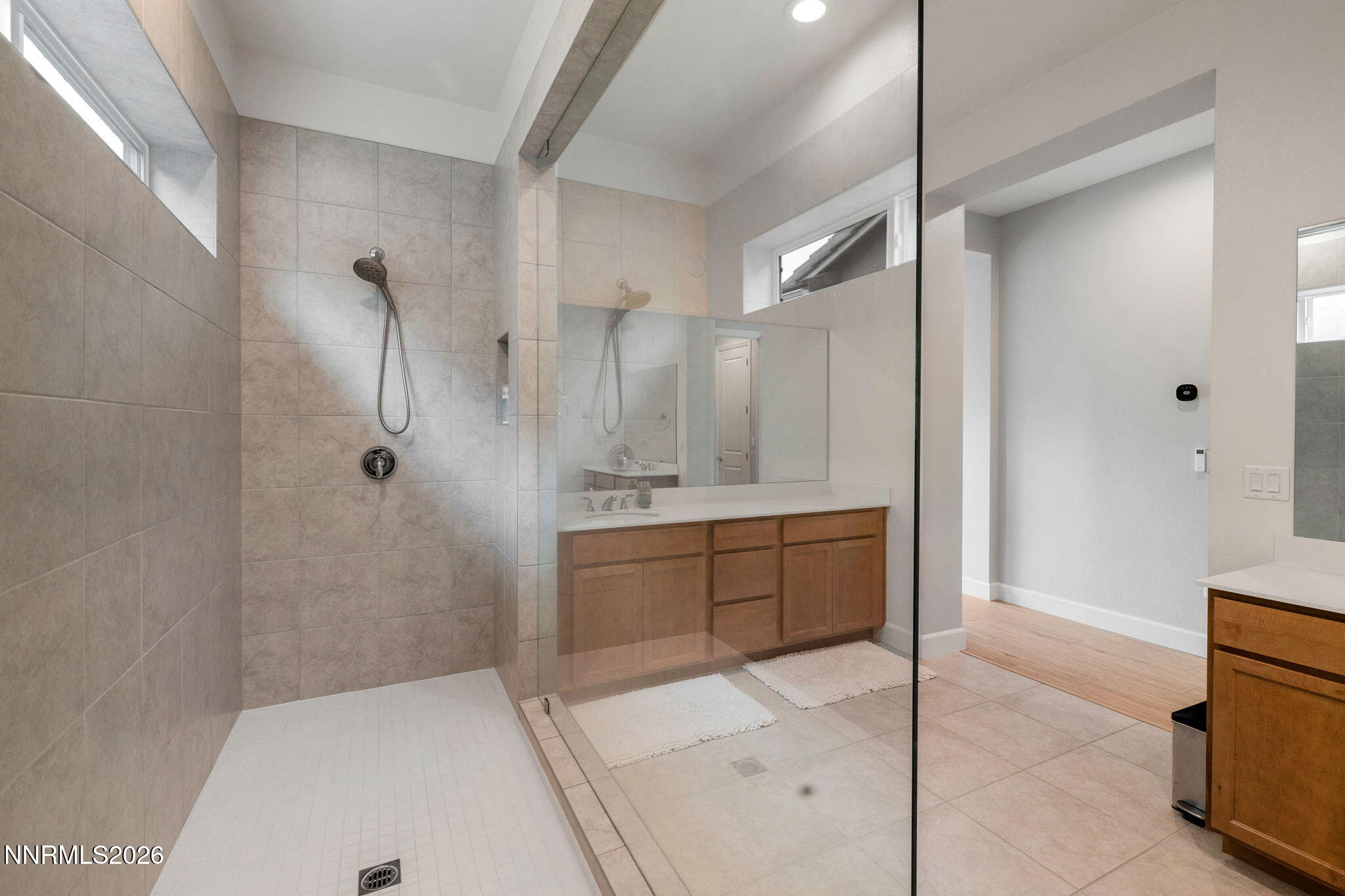 9505 Copper Sky Drive Reno, NV 89521 - Photo 23 of 50 a bathroom with a sink a toilet and shower