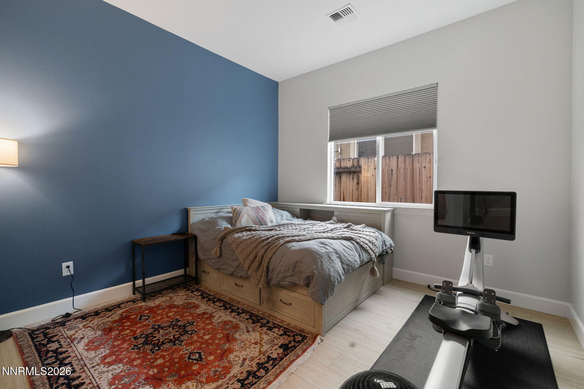 9505 Copper Sky Drive Reno, NV 89521 - Photo 25 of 50 a bedroom with a bed and a flat screen tv