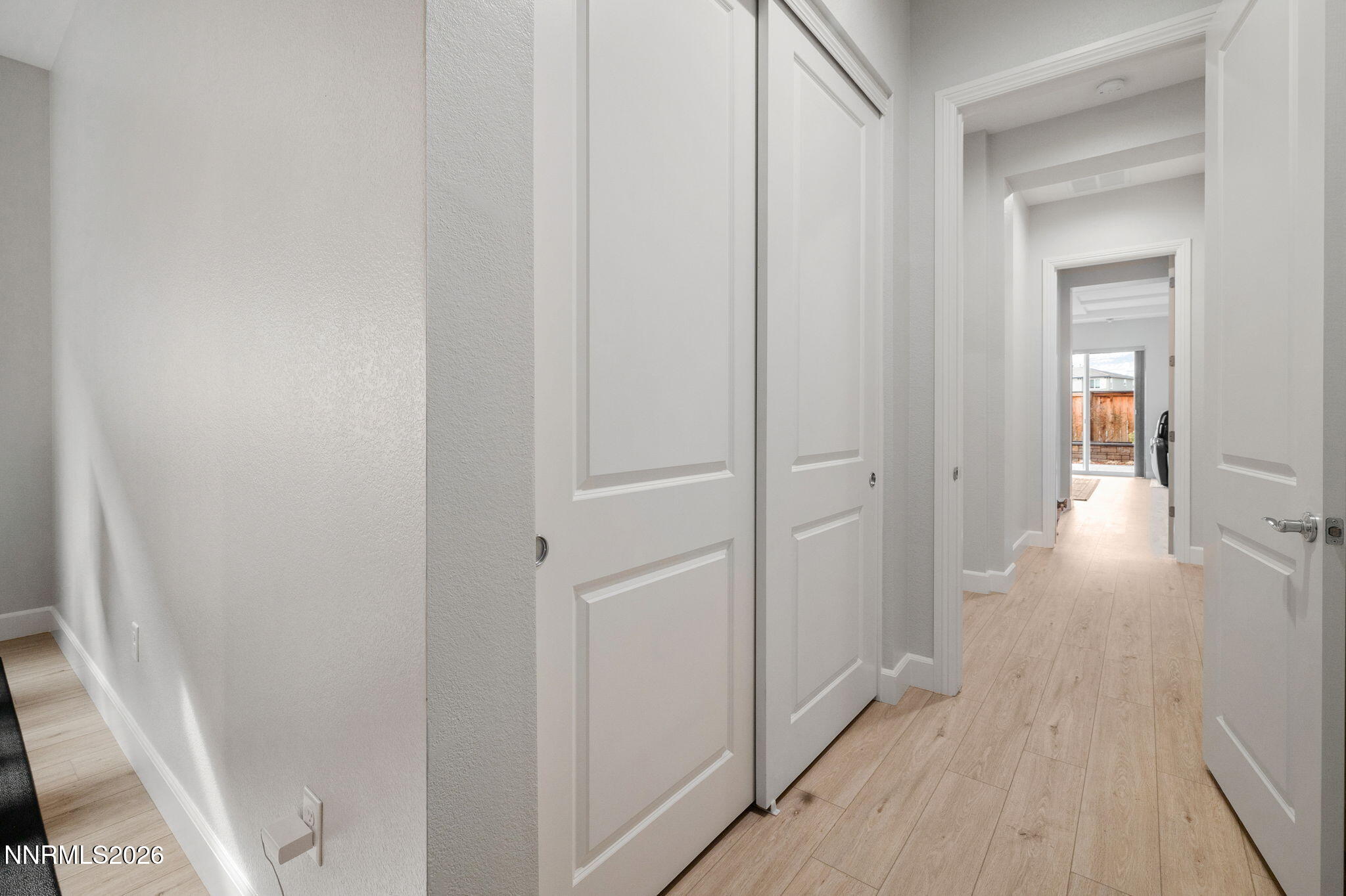 9505 Copper Sky Drive Reno, NV 89521 - Photo 27 of 50 a view of a hallway with wooden floor