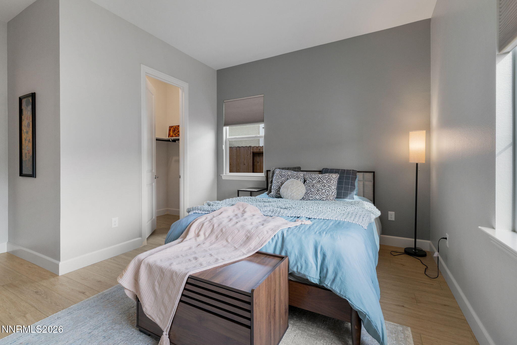 9505 Copper Sky Drive Reno, NV 89521 - Photo 33 of 50 a bedroom with a bed and wooden floor