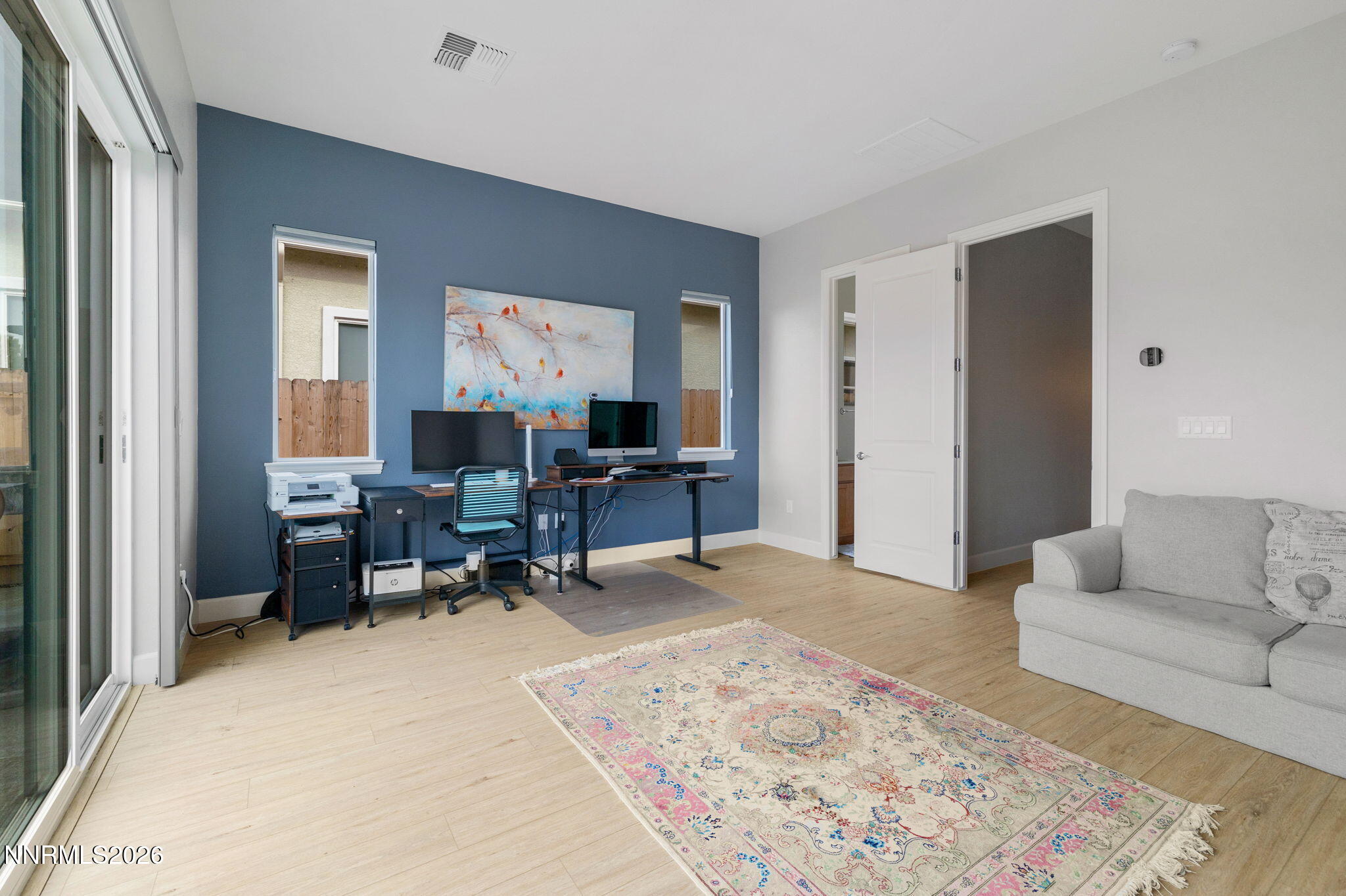 9505 Copper Sky Drive Reno, NV 89521 - Photo 35 of 50 a living room with furniture and a rug
