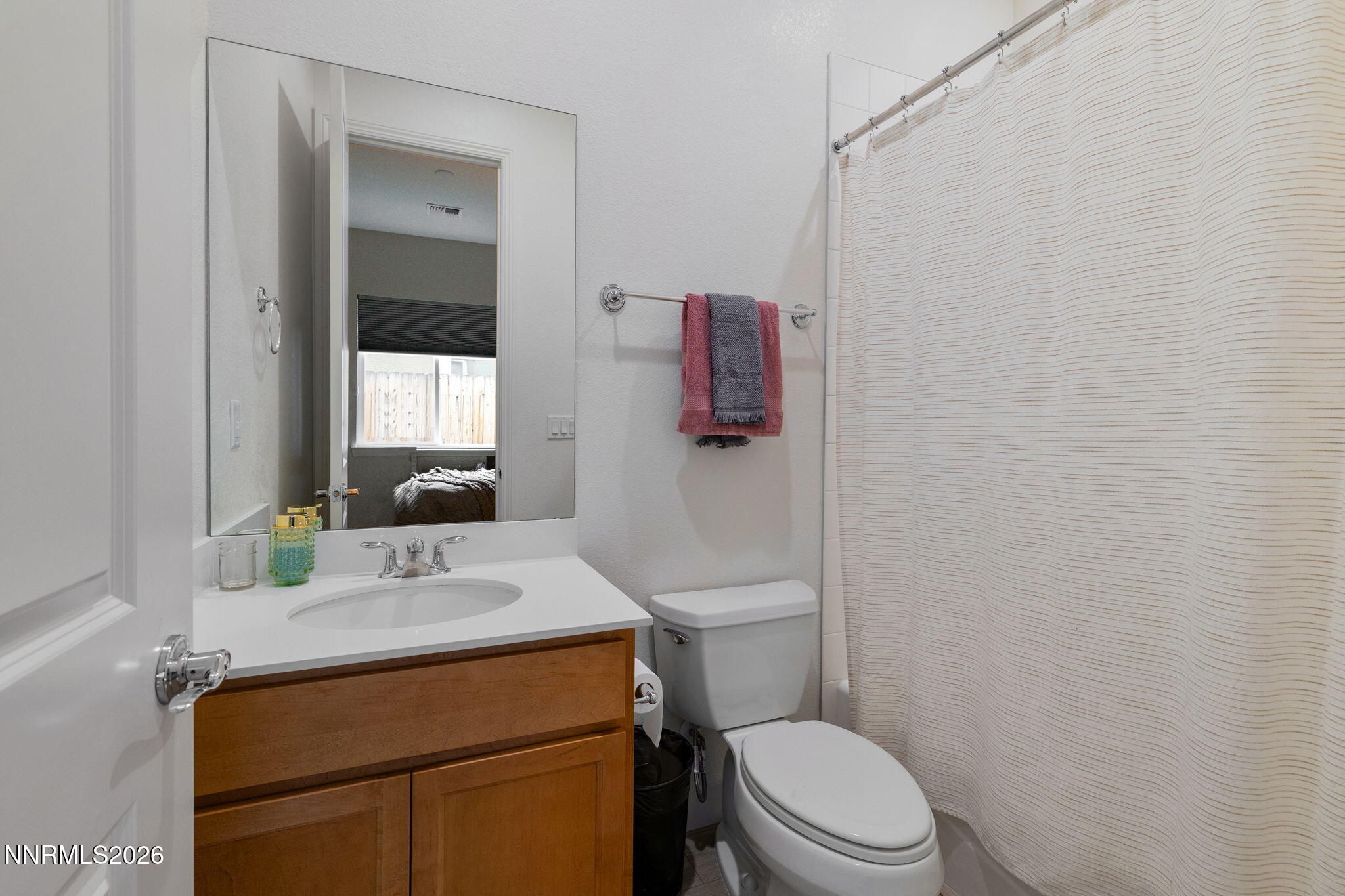 9505 Copper Sky Drive Reno, NV 89521 - Photo 36 of 50 a bathroom with a sink vanity mirror and toilet
