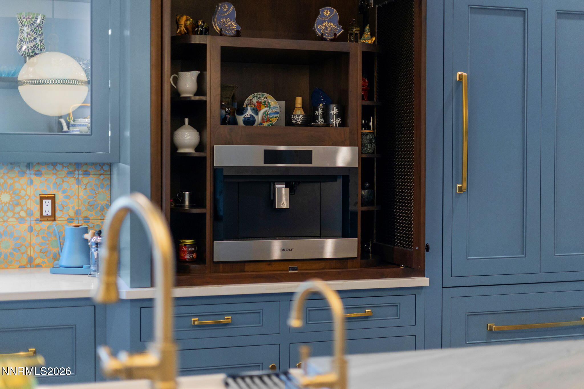 9505 Copper Sky Drive Reno, NV 89521 - Photo 48 of 50 a room with painting on the wall and a potted plant