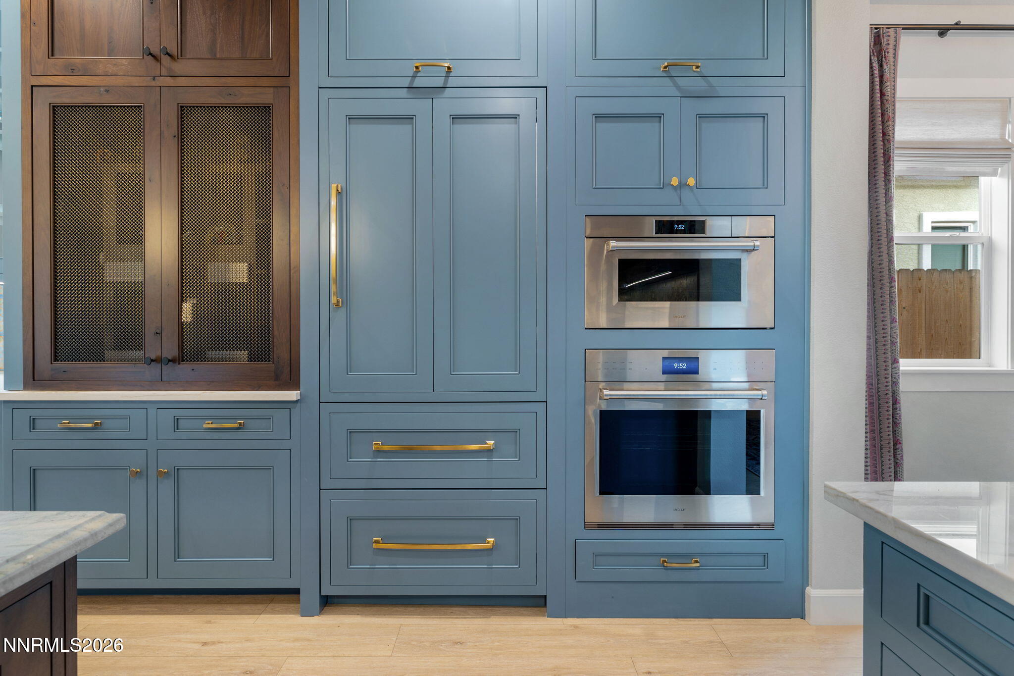 9505 Copper Sky Drive Reno, NV 89521 - Photo 50 of 50 a kitchen with stainless steel appliances white cabinets and a stove