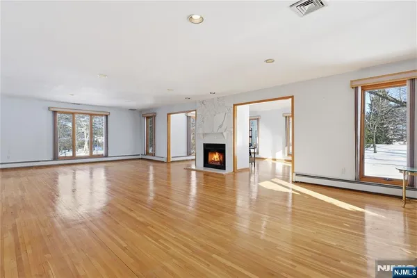 a view of a livingroom with furniture and floor to ceiling window