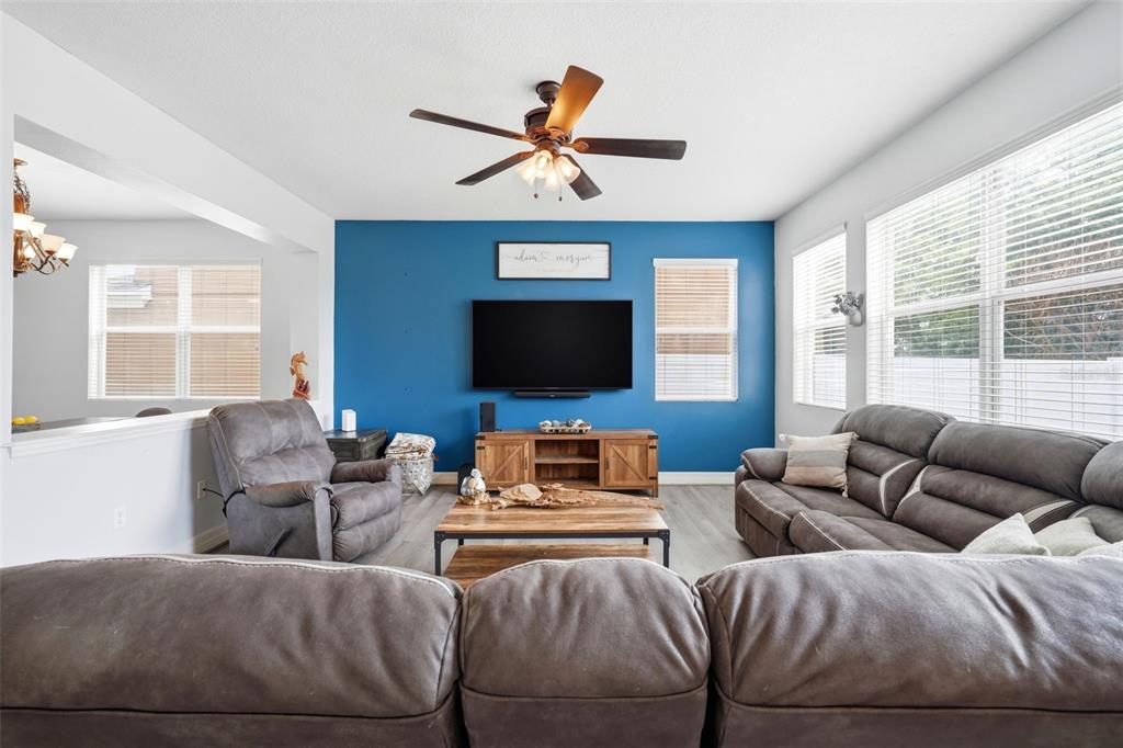1765 Strathmore Circle Mount Dora, FL 32757 - Photo 14 of 51 a living room with furniture and a flat screen tv