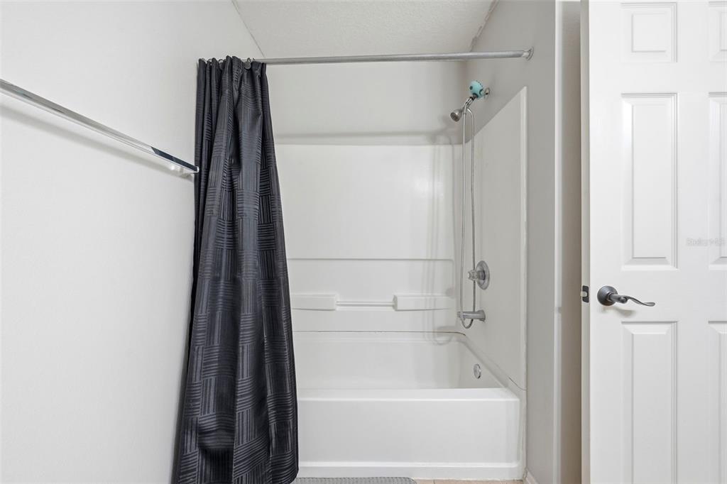 1765 Strathmore Circle Mount Dora, FL 32757 - Photo 20 of 51 a bathroom with a shower and a bath tub