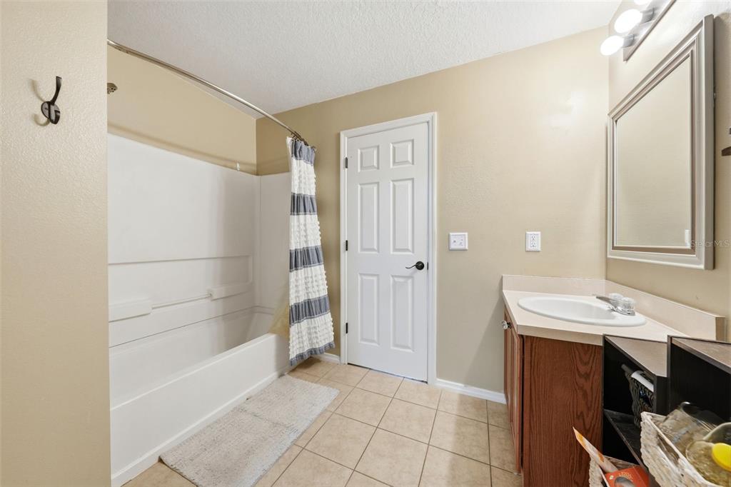 1765 Strathmore Circle Mount Dora, FL 32757 - Photo 22 of 51 a bathroom with a sink and a mirror