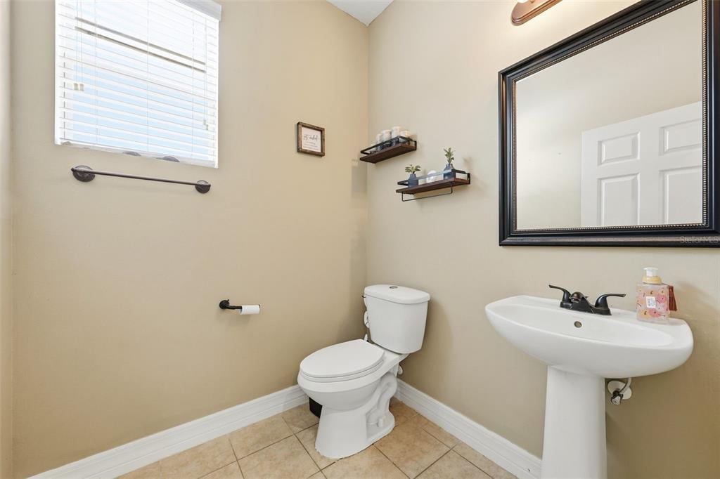 1765 Strathmore Circle Mount Dora, FL 32757 - Photo 33 of 51 a bathroom with a sink toilet and a mirror