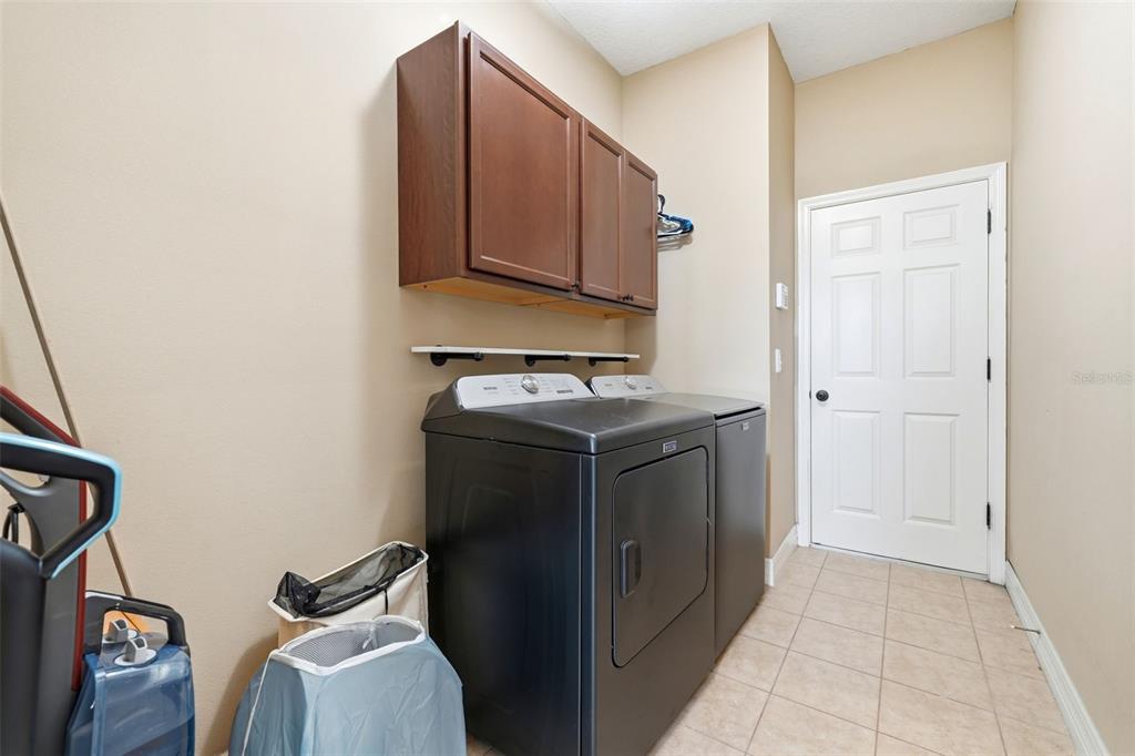 1765 Strathmore Circle Mount Dora, FL 32757 - Photo 34 of 51 a utility room with cabinets