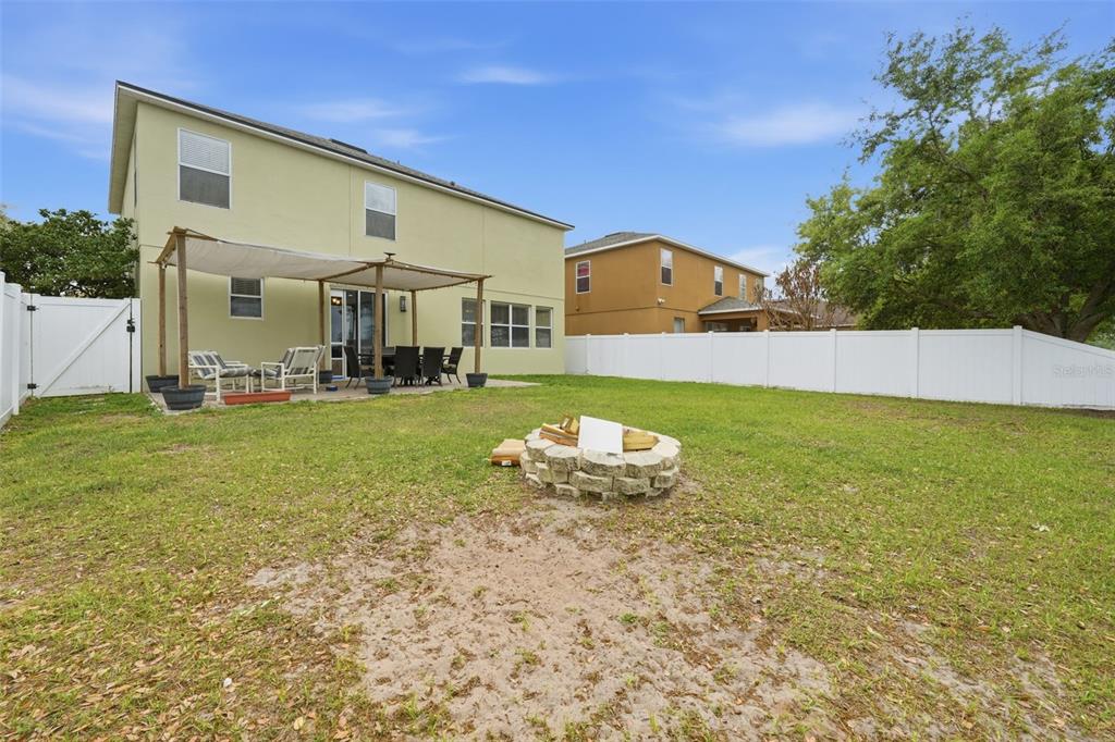 1765 Strathmore Circle Mount Dora, FL 32757 - Photo 40 of 51 a front view of a house with a yard and garage