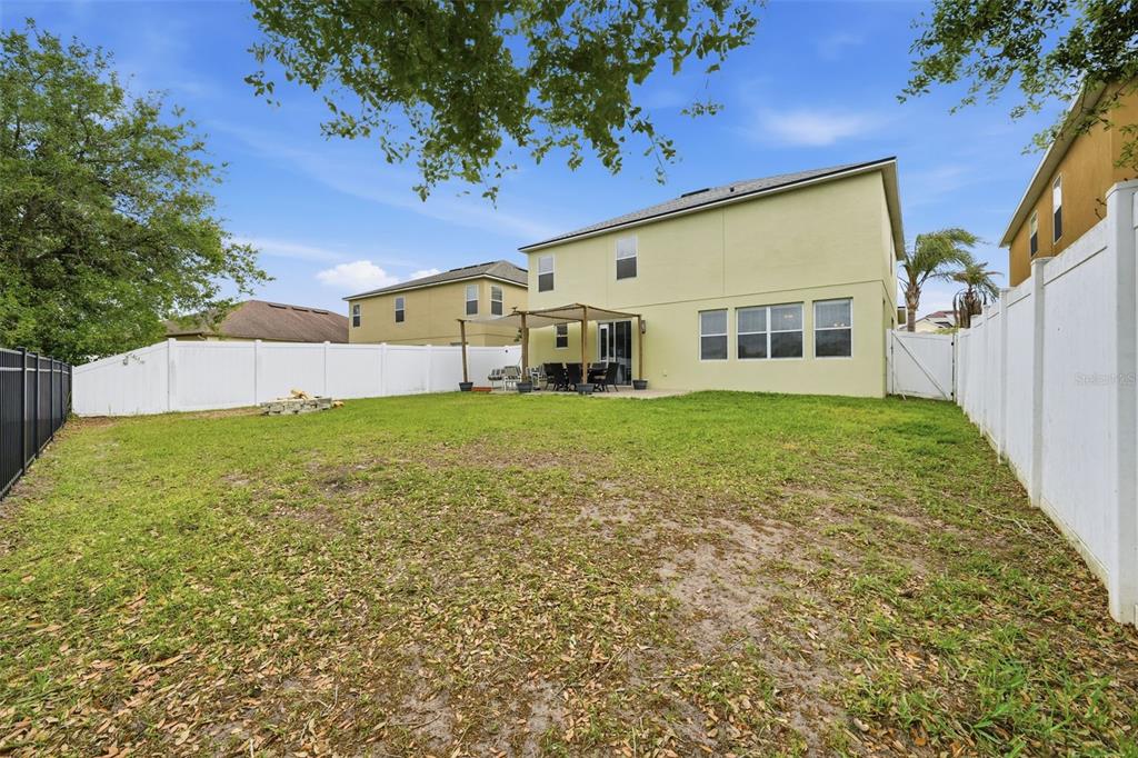 1765 Strathmore Circle Mount Dora, FL 32757 - Photo 42 of 51 front view of a house with a big yard