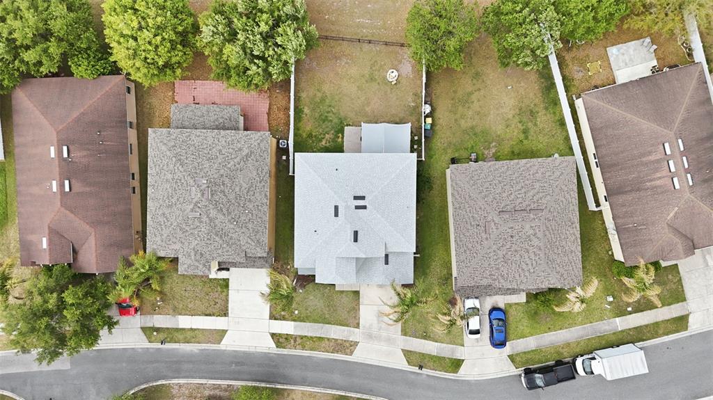 1765 Strathmore Circle Mount Dora, FL 32757 - Photo 44 of 51 an aerial view of multiple houses with outdoor space
