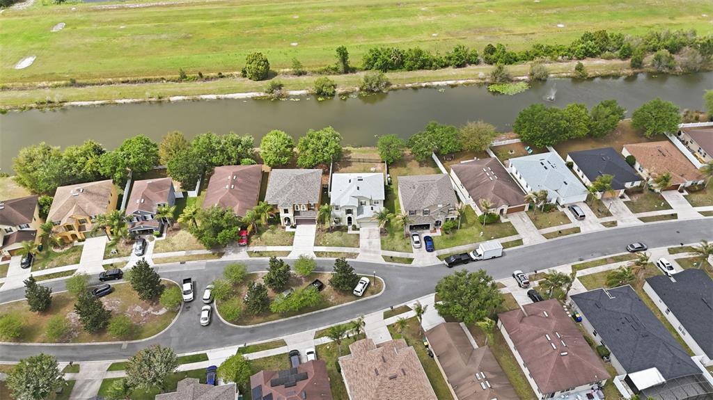 1765 Strathmore Circle Mount Dora, FL 32757 - Photo 46 of 51 an aerial view of residential houses with outdoor space and lake view