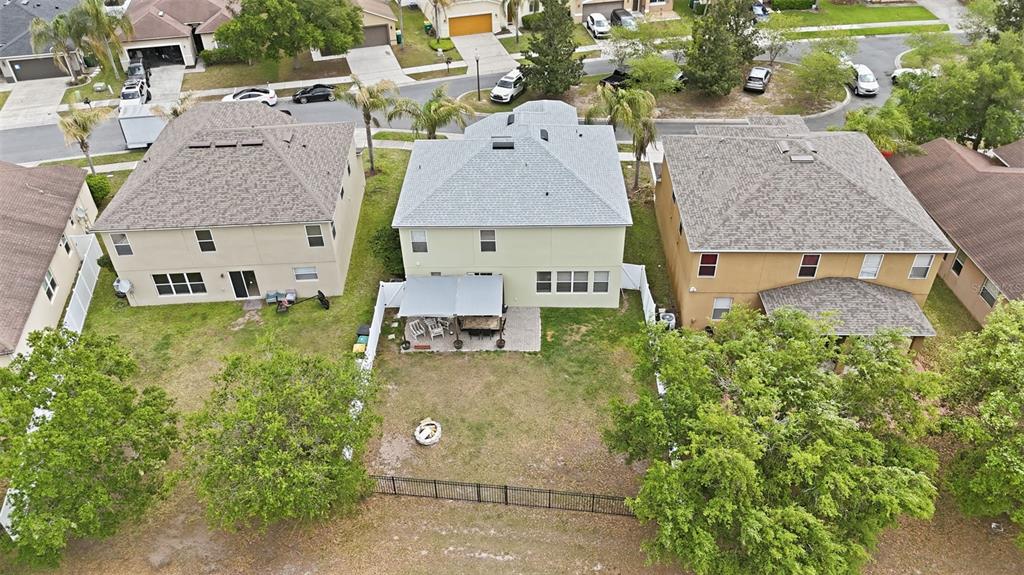 1765 Strathmore Circle Mount Dora, FL 32757 - Photo 48 of 51 an aerial view of residential houses with outdoor space and parking