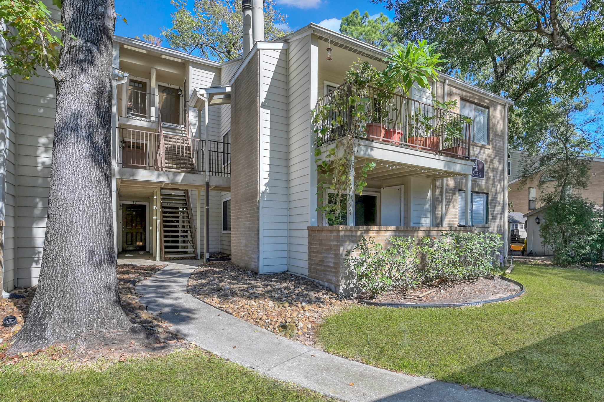 3500 Tangle Brush Drive, Unit 40 Spring, TX 77381 - Photo 1 of 19 front view of a house with a yard