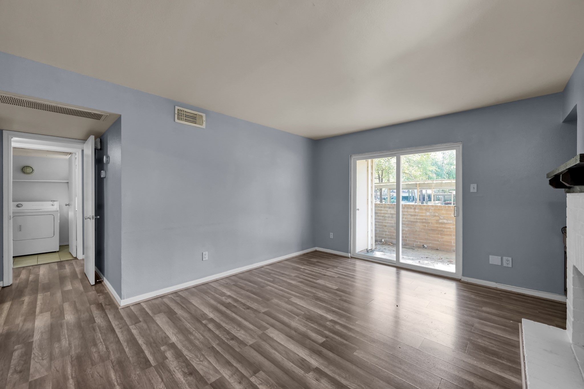 3500 Tangle Brush Drive, Unit 40 Spring, TX 77381 - Photo 7 of 19 wooden floor in an empty room with a window