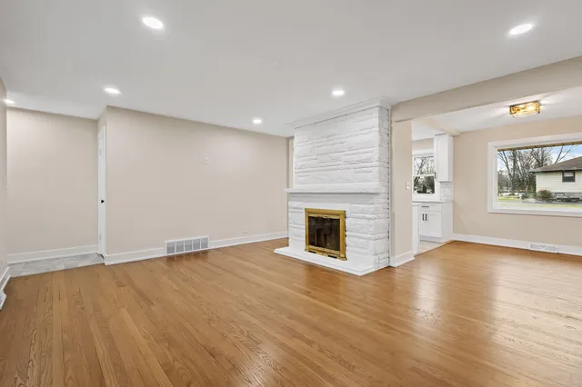 a living room with furniture flat screen tv and a fireplace