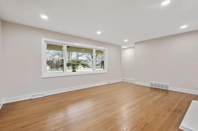 a view of kitchen with cabinets and wooden floor