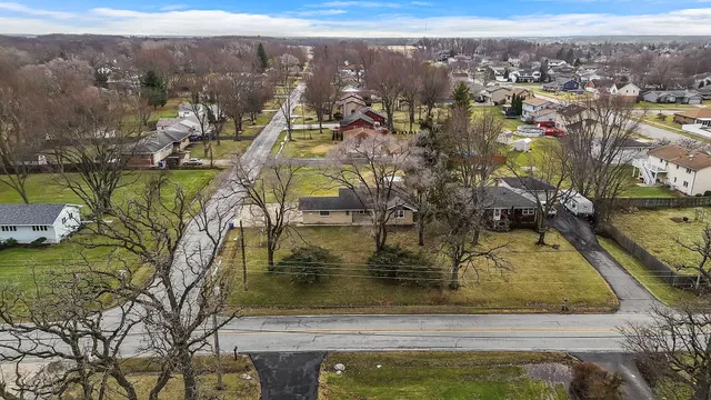 a view of a swimming pool with a yard