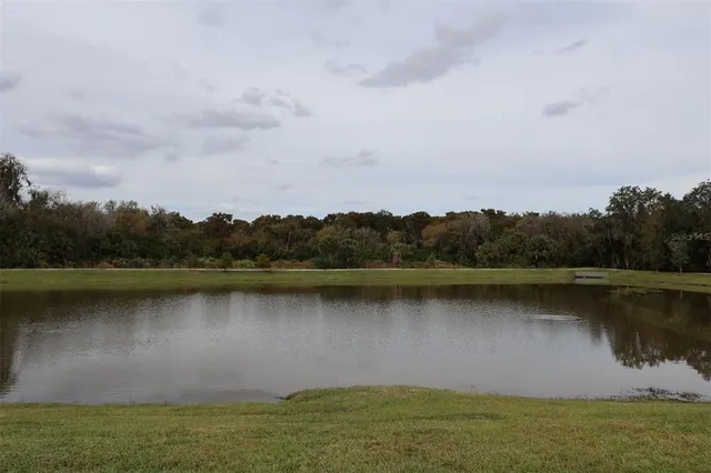 an aerial view of a city with lake view
