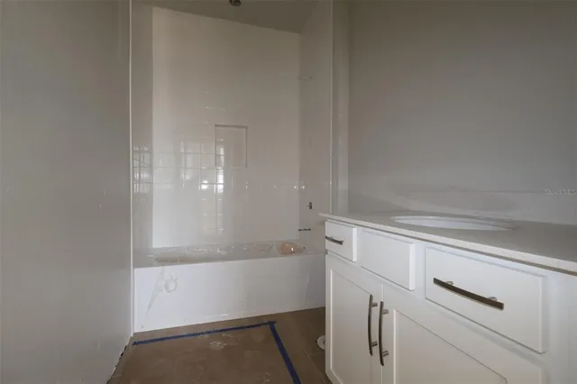 a view of storage and utility room with washer and dryer