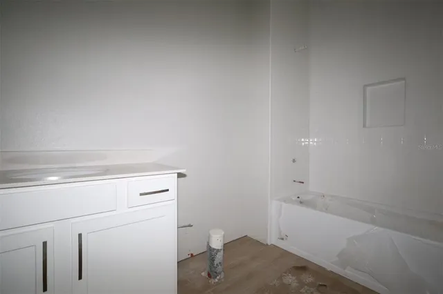 a bathroom with a sink and vanity