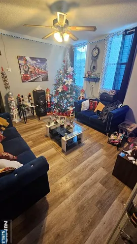 a living room with furniture and a chandelier