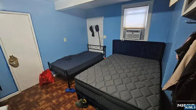 a bedroom with a bed and dresser