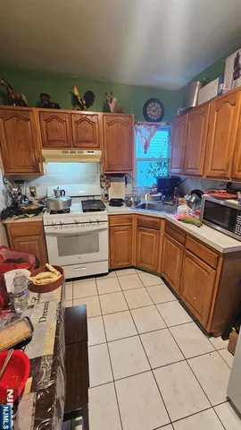 a kitchen with stainless steel appliances granite countertop a sink and cabinets