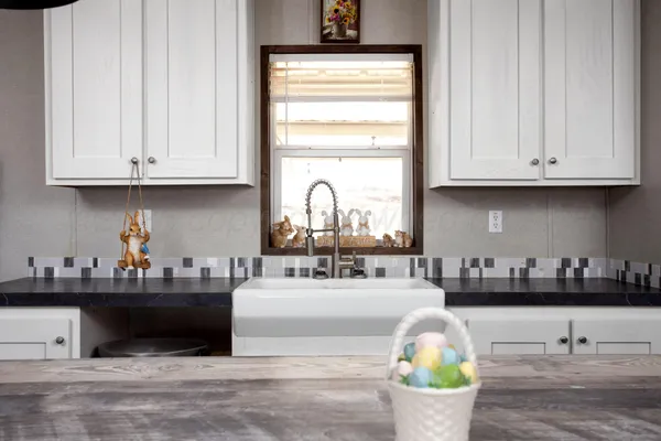 a kitchen with a sink and cabinets