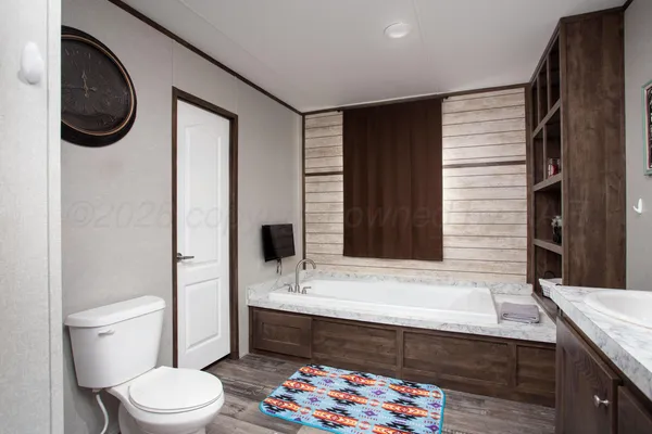 a bathroom with a sink a toilet and a bathtub