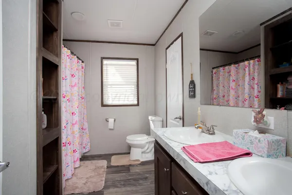 a bath room with a sink and a mirror
