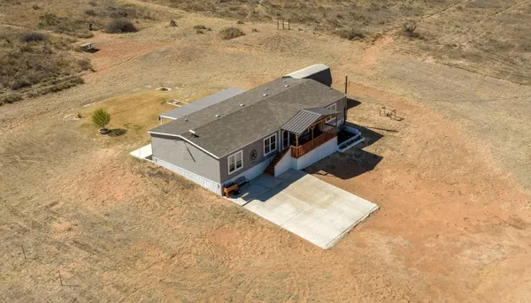 an aerial view of houses with wooden floor
