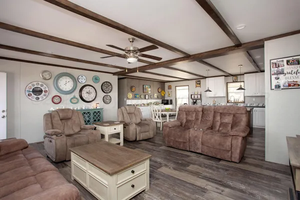 a living room with lots of furniture and white walls