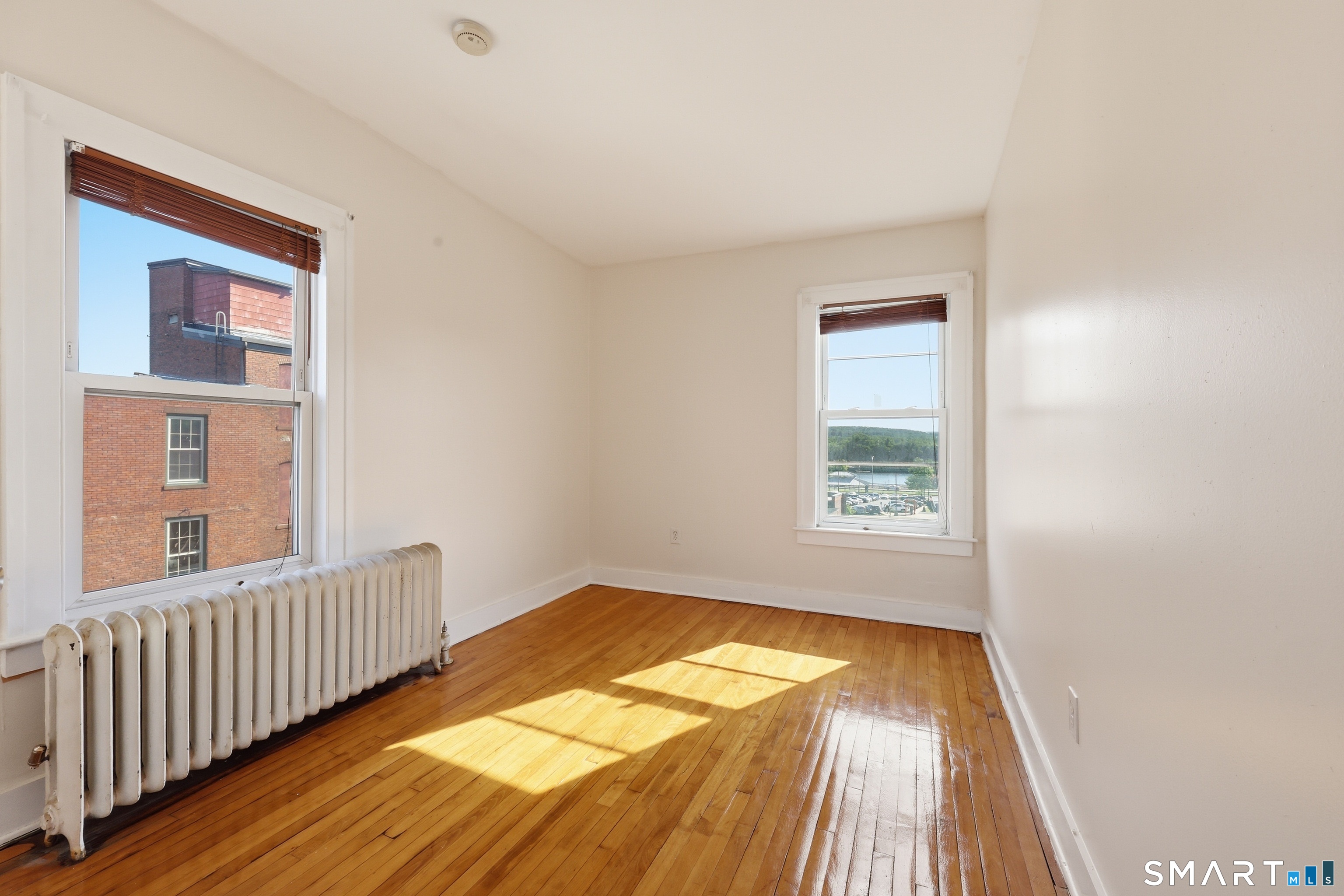 360 Main Street, Unit 3B Middletown, CT 06457 - Photo 8 of 21 a view of a room with wooden floor and windows
