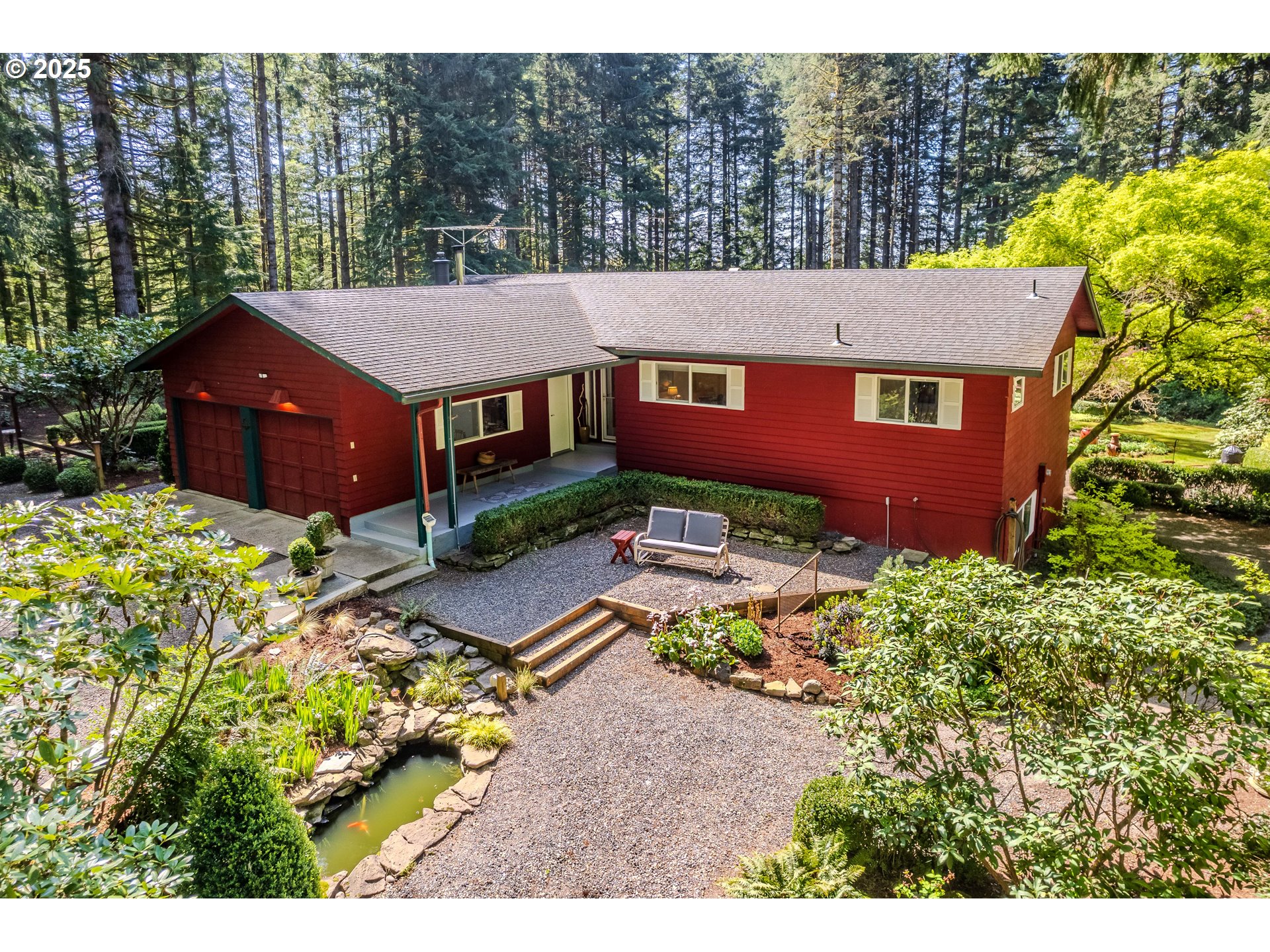 41920 Southeast Gordon Creek Road Corbett, OR 97019 - Photo 1 of 48 an aerial view of a house with a yard