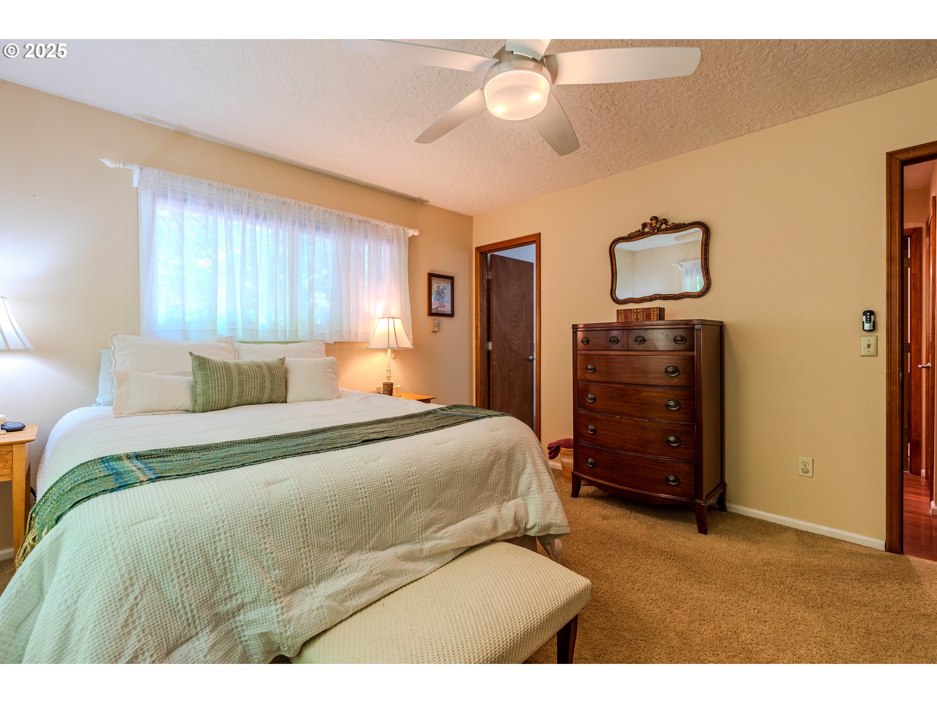 41920 Southeast Gordon Creek Road Corbett, OR 97019 - Photo 14 of 48 a bedroom with a bed and wooden floor