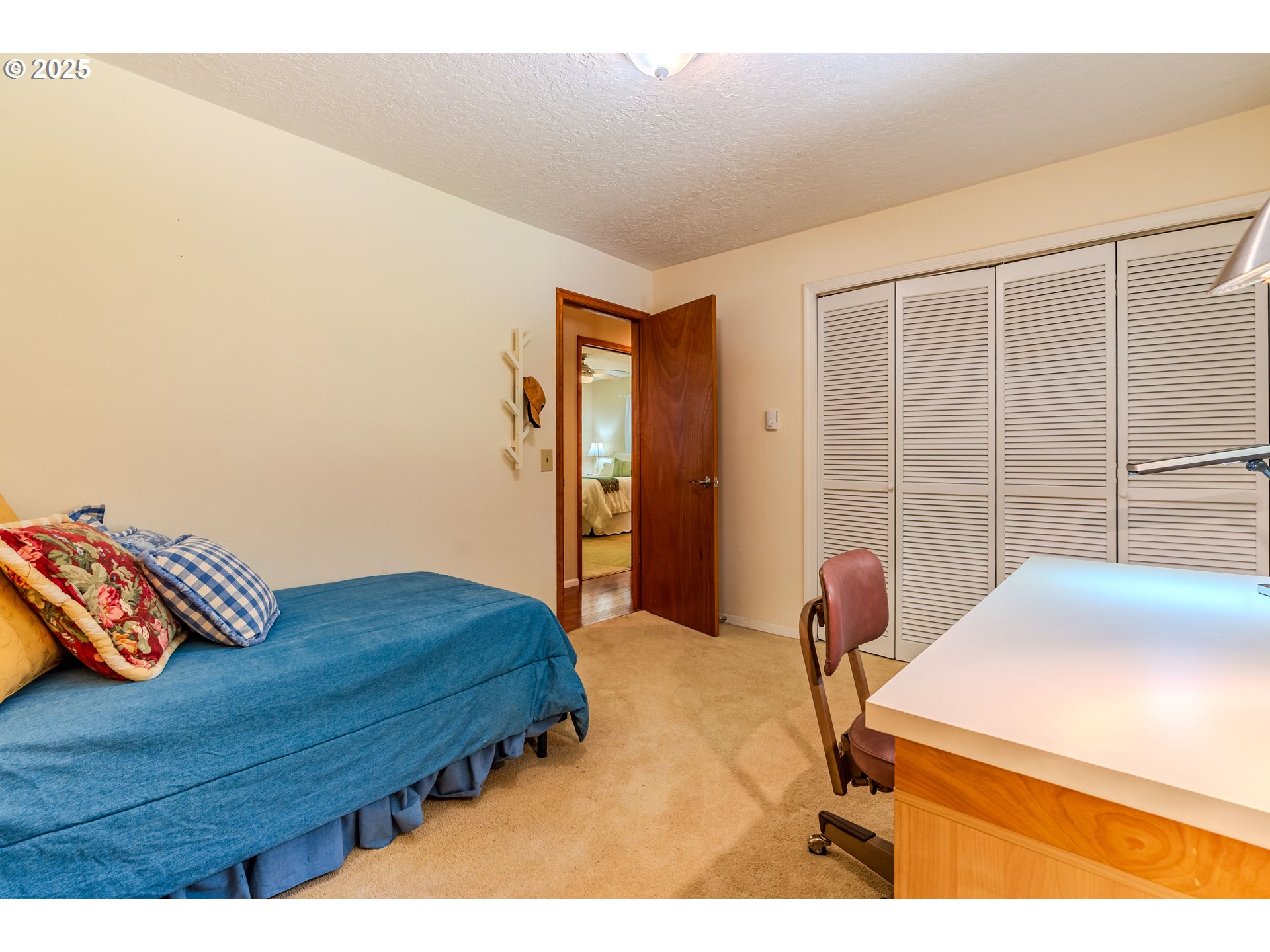 41920 Southeast Gordon Creek Road Corbett, OR 97019 - Photo 17 of 48 a bedroom with a bed and wooden floor