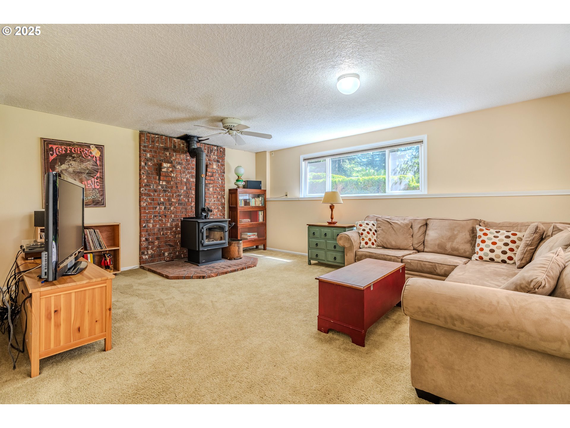 41920 Southeast Gordon Creek Road Corbett, OR 97019 - Photo 20 of 48 a living room with furniture and a flat screen tv