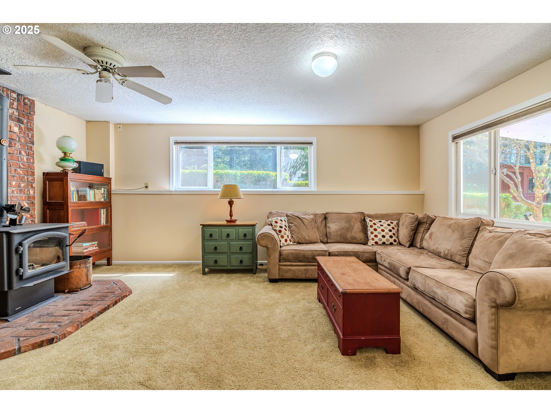41920 Southeast Gordon Creek Road Corbett, OR 97019 - Photo 21 of 48 a living room with furniture and a flat screen tv