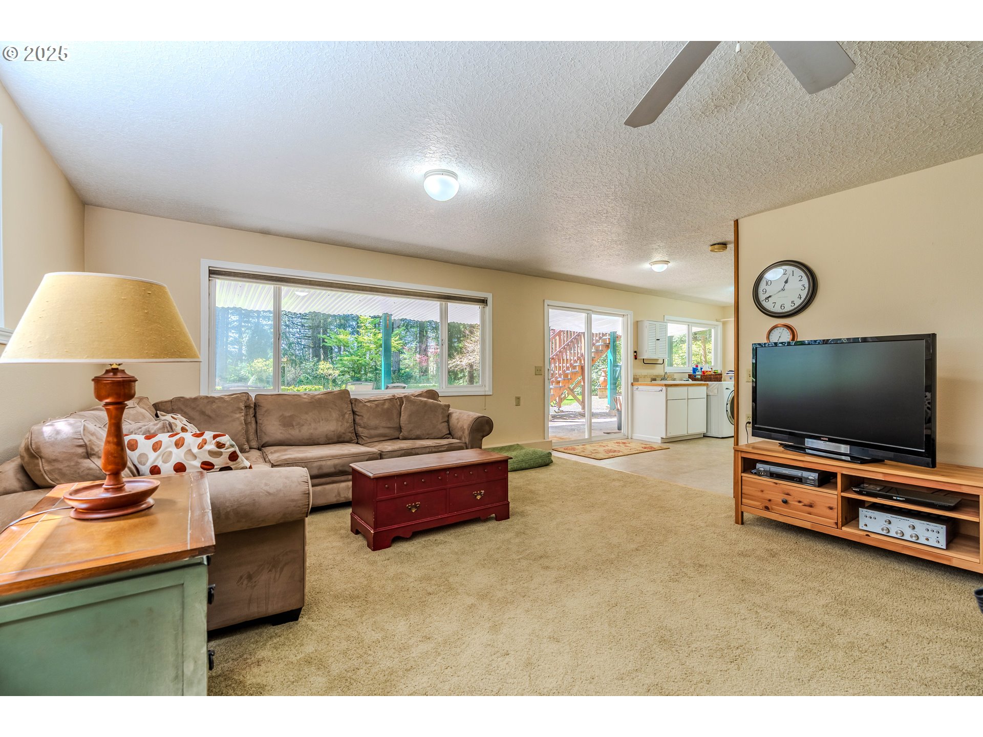 41920 Southeast Gordon Creek Road Corbett, OR 97019 - Photo 22 of 48 a living room with furniture and a flat screen tv