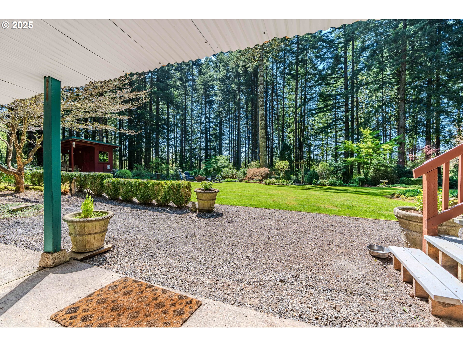 41920 Southeast Gordon Creek Road Corbett, OR 97019 - Photo 29 of 48 a view of a garden with plants and large trees